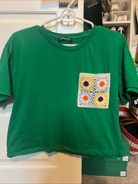 Green Cropped Tee with Crochet Flower Pocket